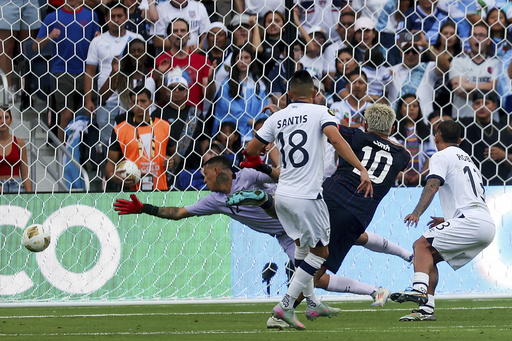 United States midfielder Diego Luna (10) scores a goal past Guatemala goalkeeper Kenderson Navarrol, left, during the first half of a CONCACAF Gold Cup semifinal soccer match, Wednesday, July 2, 2025, in St. Louis. (AP Photo/Scott Kane)