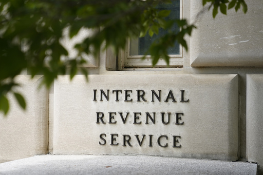 FILE - A sign outside the Internal Revenue Service building is photographed May 4, 2021, in Washington. (AP Photo/Patrick Semansky, File)