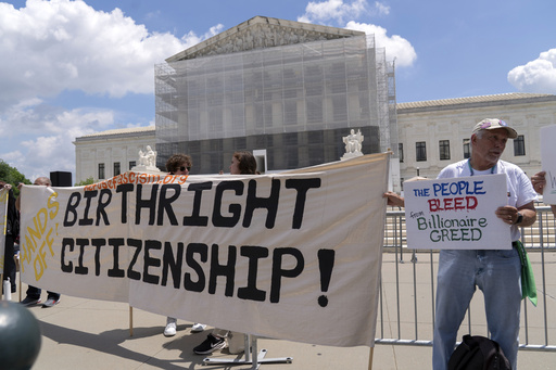 FILE - Demonstrators holds up a banner during a citizenship rally outside of the Supreme Court in Washington, May 15, 2025. (AP Photo/Jose Luis Magana, File)
