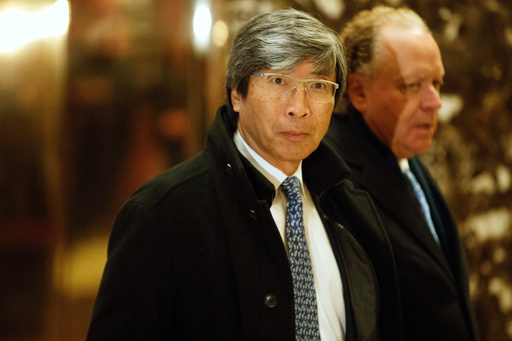FILE - Dr. Patrick Soon-Shiong arrives in the lobby of Trump Tower in New York, Jan. 10, 2017. (AP Photo/Evan Vucci, file)