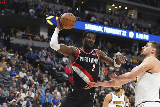 FILE - Portland Trail Blazers center Deandre Ayton (2) and Denver Nuggets center Nikola Jokic (15) vie for the ball in the second half of an NBA basketball game, Feb. 10, 2025, in Denver. (AP Photo/David Zalubowski, File)