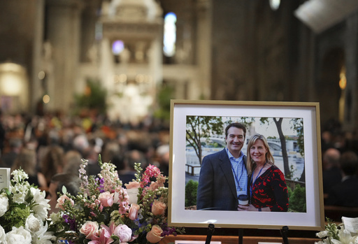 Pictures of Mark and Melissa Hortman are set up inside the sanctuary at the Basilica of St. Mary's during funeral services for Mark and Melissa Hortman in Minneapolis, Minn., on Saturday, June 28, 2025. (Alex Kormann/Star Tribune via AP, Pool)