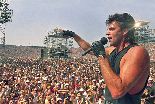 FILE - Rick Springfield performs at Live Aid, a famine relief concert at JFK Stadium in Philadelphia Pa., Jon uly 13, 1985. (AP Photo/Amy Sancetta, File)