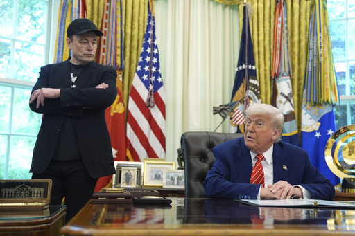 FILE - President Donald Trump, right, speaks during a news conference with Elon Musk in the Oval Office of the White House, Friday, May 30, 2025, in Washington. (AP Photo/Evan Vucci, File)
