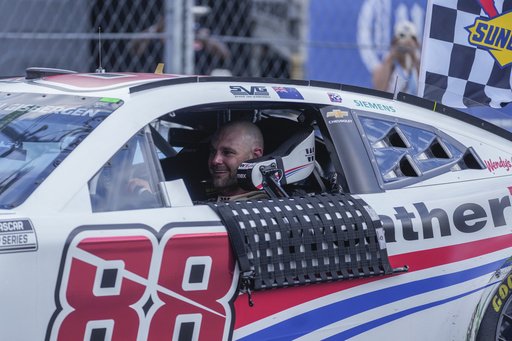 Shane van Gisbergen drives to Victory Lane after winning a NASCAR Cup Series auto race at the Grant Park 165, Sunday, July 6, 2025, in Chicago. (AP Photo/Erin Hooley)