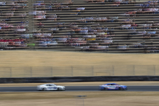 Kyle Larson (5) drives while followed by Chase Elliott (9) during a NASCAR Cup Series auto race at Sonoma Raceway, Sunday, July 13, 2025, in Sonoma, Calif. (AP Photo/Godofredo A. Vásquez)