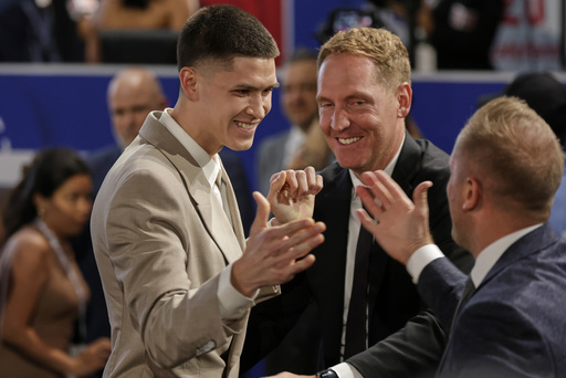 Egor Demin celebrates after being selected eighth by the Brooklyn Nets in the first round of the NBA basketball draft, Wednesday, June 25, 2025, in New York. (AP Photo/Adam Hunger)