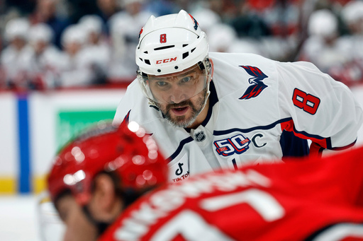 FILE - Washington Capitals' Alex Ovechkin (8) looks on during a faceoff against the Carolina Hurricanes during the first period of an NHL hockey game in Raleigh, N.C., Wednesday, April 2, 2025. (AP Photo/Karl DeBlaker, File)
