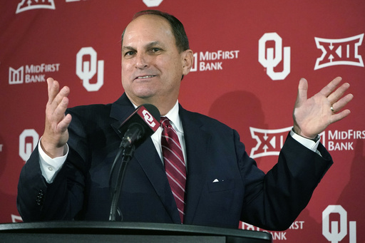 FILE - Oklahoma Athletics Director Joe Castiglione gestures as he speaks during an NCAA college football news conference, Monday, Nov. 29, 2021, in Norman, Okla. (AP Photo/Sue Ogrocki, File)