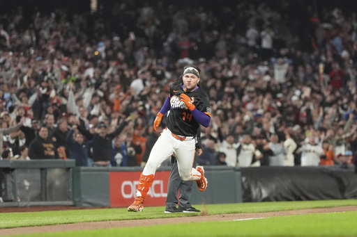 San Francisco Giants' Patrick Bailey runs home to score after hitting a three-run inside the park home run during the ninth inning of a baseball game to defeat the Philadelphia Phillies in San Francisco, Tuesday, July 8, 2025. (AP Photo/Jeff Chiu)