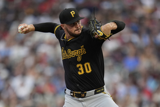 Pittsburgh Pirates starting pitcher Paul Skenes delivers during the third inning of a baseball game against the Minnesota Twins, Friday, July 11, 2025, in Minneapolis. (AP Photo/Abbie Parr)