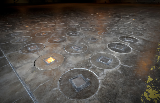 FILE - Radioactive waste sealed in large stainless steel canisters is stored under five feet of concrete in a storage building at the Savannah River Site, near Aiken, S.C., Nov. 20, 2013. (AP Photo/Stephen B. Morton, File)