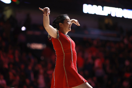 FILE - Rong Niu, also known as the performer Red Panda, performs at halftime during an NBA basketball game between the New Orleans Pelicans and the Los Angeles Clippers in New Orleans, Jan. 5, 2024. (AP Photo/Tyler Kaufman, File)