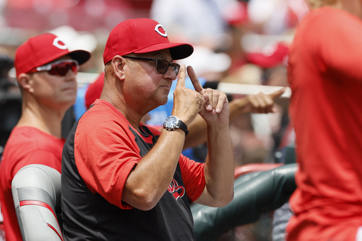 Cincinnati Reds manager Terry Francona signals to his team against the Colorado Rockies during the third inning of a baseball game, Sunday, July 13, 2025, in Cincinnati. (AP Photo/Jay LaPrete)
