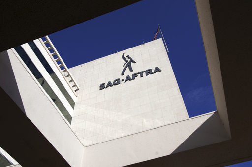 FILE - SAG-AFTRA signage is seen on the side of the headquarters in Los Angeles on Friday, Nov. 10, 2023. (AP Photo/Richard Vogel,File)