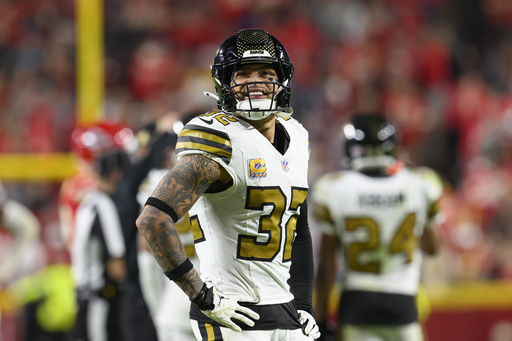 FILE - New Orleans Saints safety Tyrann Mathieu looks to the scoreboard during the second half of an NFL football game against the Kansas City Chiefs, Oct. 7, 2024 in Kansas City, Mo. (AP Photo/Reed Hoffmann, File)