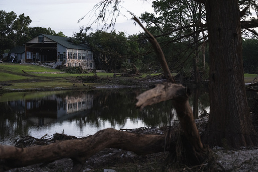 Camp Mystic stands next a creek that feeds into the Guadalupe River, Monday, July 7, 2025, in Hunt, Texas, after flash flooding swept through the area. (AP Photo/Eli Hartman)