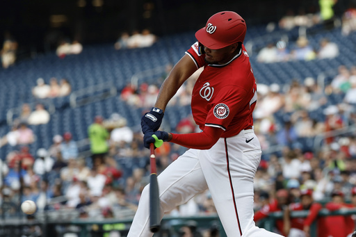 Washington Nationals' James Wood hits a single against Detroit Tigers pitcher Jack Flaherty during the first inning in the second baseball game of a doubleheader in Washington, Wednesday, July 2, 2025. (AP Photo/Terrance Williams)