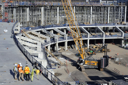 FILE - Construction continues on a new enclosed stadium for NFL football's Tennessee Titans, March 3, 2025, in Nashville, Tenn. (AP Photo/Mark Humphrey, File)