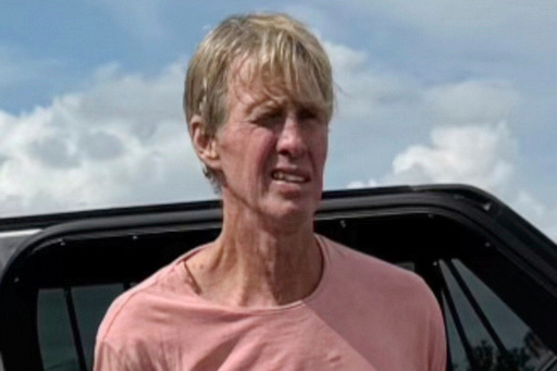 FILE - In this image released by the Martin County, Fla., Sheriff's Office, law enforcement officers arrest Ryan Wesley Routh, a man suspected in an apparent assassination attempt of Donald Trump, Sept. 15, 2024. (Martin County Sheriff's Office via AP, File)