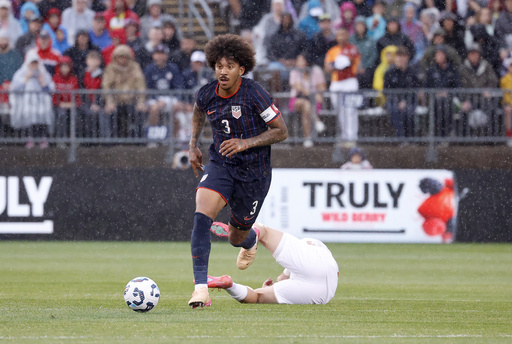 United States defender Chris Richards (3) dribble the ball up the field past a fallen Turkey defender during the first half of an international friendly soccer game, Saturday, June 7, 2025, in East Hartford, Conn. (AP Photo/Mary Schwalm)