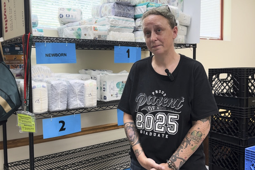 In this image taken from video, Amanda Hinton speaks about work requirements for Medicaid and the Supplemental Nutrition Assistance Program during an interview, Tuesday, July 1, 2025, at the Samaritan Center food pantry in Jefferson City, Mo. (AP Photo/David A. Lieb)