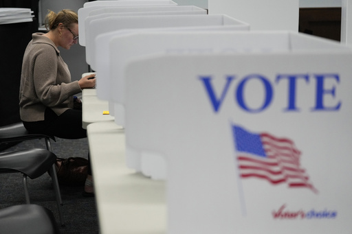 FILE - Whitney Cooper casts her ballot on Election Day, Nov. 5, 2024, in Canton, N.C. (AP Photo/George Walker IV, file)