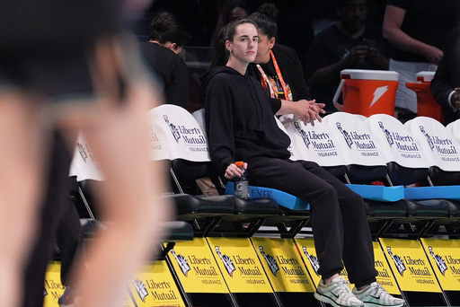 FILE - Indiana Fever's Caitlin Clark watches as players warm up before a WNBA basketball game between the New York Liberty and the Fever Wednesday, July 16, 2025, in New York. (AP Photo/Frank Franklin II, File)