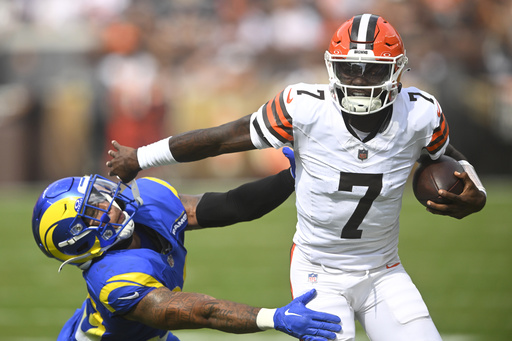 Cleveland Browns quarterback Tyler Huntley (7) runs against Los Angeles Rams safety Malik Dixon-Williams (39) in the second half of an NFL preseason football game Saturday, Aug. 23, 2025, in Cleveland. (AP Photo/David Richard)