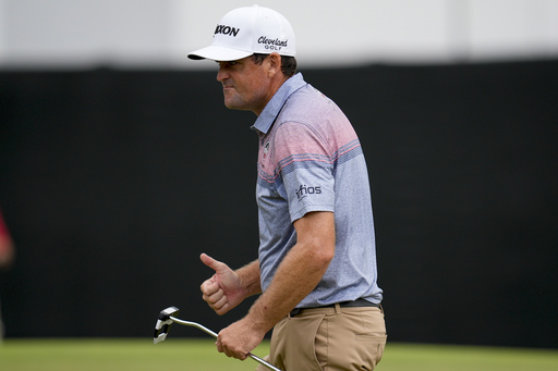Keegan Bradley reacts to his birdie on the 18th green during the second round of the Tour Championship golf tournament, Friday, Aug. 22, 2025, in Atlanta. (AP Photo/Mike Stewart)