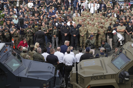 President Donald Trump speaks with members of law enforcement and National Guard soldiers, Thursday, Aug. 21, 2025, in Washington. (AP Photo/Jacquelyn Martin)
