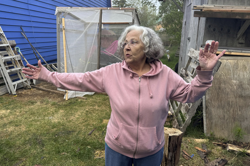 Gloria Simeon, co-founder of the Mother Kuskokwim Tribal Coalition, speaks during an interview outside her smokehouse in Bethel, Alaska, on June 18, 2025. (AP Photo/Mark Thiessen)
