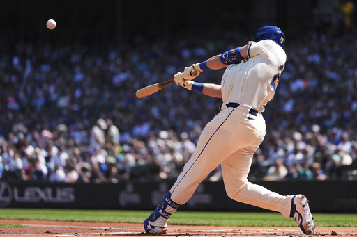 Seattle Mariners' Cal Raleigh hits a two-run home run against the Athletics during the first inning of a baseball game Sunday, Aug. 24, 2025, in Seattle. (AP Photo/Lindsey Wasson)