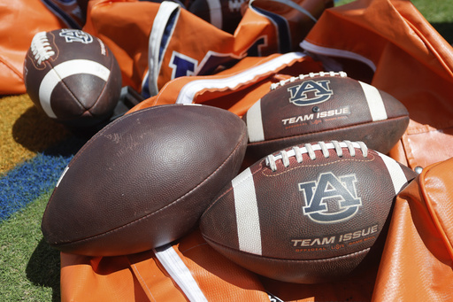 FILE - Auburn footballs sit in a bag prior to an NCAA football game against Georgia, Sept. 30, 2023, in Auburn, Ala. (AP Photo/Stew Milne, File)