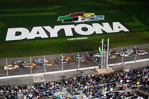FILE - Drivers pass the start line after a caution during the NASCAR Daytona 500 auto race at Daytona International Speedway, Feb. 16, 2025, in Daytona Beach, Fla. (AP Photo/Phelan M. Ebenhack, File)