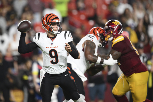 Cincinnati Bengals quarterback Joe Burrow (9) throws during the first half of a preseason NFL football game against the Washington Commanders Monday, Aug. 18, 2025, in Landover, Md. (AP Photo/Nick Wass)