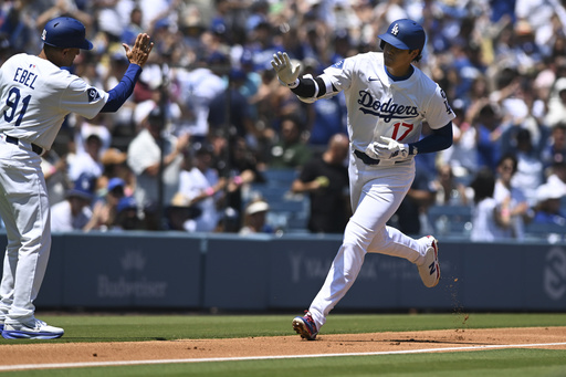 Los Angeles Dodgers designated hitter Shohei Ohtani runs on his solo home run against the Toronto Blue Jays during the first inning of a baseball game Sunday, Aug. 10, 2025, in Los Angeles. (AP Photo/Wally Skalij)