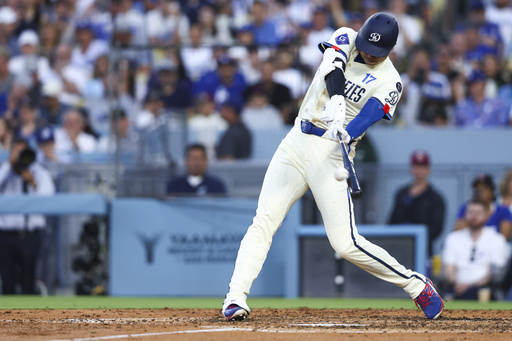 Los Angeles Dodgers' Shohei Ohtani hits a home run during the fifth inning of a baseball game against the Toronto Blue Jays, Saturday, Aug. 9, 2025, in Los Angeles. (AP Photo/Jessie Alcheh)