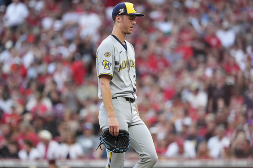 Milwaukee Brewers' Jacob Misiorowski exits the game in the second inning of a baseball game Cincinnati Reds, Friday, Aug. 15, 2025, in Cincinnati. (AP Photo/Kareem Elgazzar)