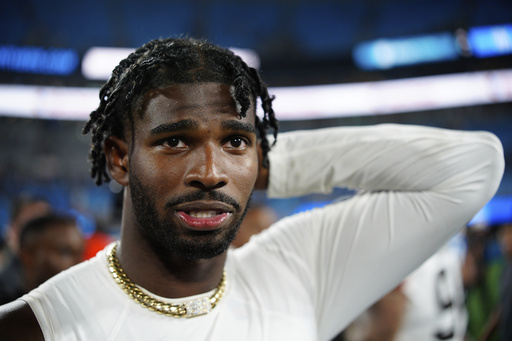 Cleveland Browns quarterback Shedeur Sanders walks of the field after a preseason NFL football game against the Carolina Panthers on Friday, Aug. 8, 2025, in Charlotte, N.C. (AP Photo/Jacob Kupferman)