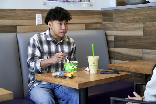 Braxton Kimura eats at Vitality Bowl on Wednesday, Aug. 13, 2025, in San Jose, Calif. (AP Photo/Terry Chea)