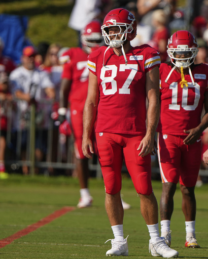 Kansas City Chiefs tight end Travis Kelce (87) waits to stretch at NFL football training camp Tuesday, Aug. 5, 2025, in St. Joseph, Mo. (AP Photo/Charlie Riedel)