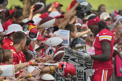 Kansas City Chiefs wide receiver Rashee Rice signs autographs at NFL football training camp Friday, Aug. 1, 2025, in St. Joseph, Mo. (AP Photo/Charlie Riedel)