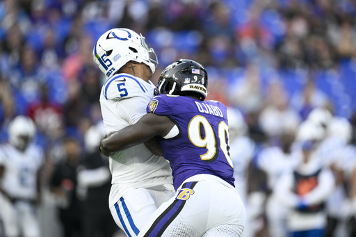 Indianapolis Colts quarterback Anthony Richardson Sr. (5) is sacked by Baltimore Ravens linebacker David Ojabo (90) during the firs half of an NFL preseason football game Thursday, Aug. 7, 2025, in Baltimore. (AP Photo/Nick Wass)