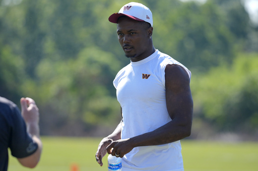 Washington Commanders wide receiver Terry McLaurin walks across the field after a practice at the team's NFL football training camp, Sunday, July 27, 2025, in Ashburn, Va. (AP Photo/Mark Schiefelbein)