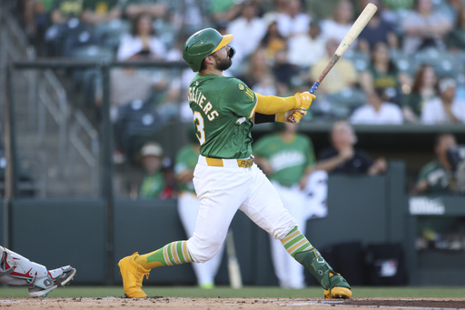 Athletics' Shea Langeliers watches his two-run home run during the first inning of a baseball game against the Arizona Diamondbacks, Friday, Aug. 1, 2025, in West Sacramento, Calif. (AP Photo/Scott Marshall)