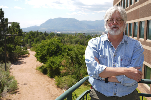 Professor Jeffrey Scholes, who is co-director for the Center for the Study of Evangelicalism as well as director for the Center for Religious Diversity and Public Life at the University of Colorado Colorado Springs, poses for a portrait on the school's campus Tuesday, Aug. 12, 2025, in Colorado Springs, Colo. (AP Photo/David Zalubowski)