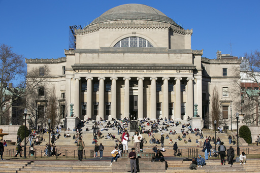 FILE - Students sit on the front steps of Low Memorial Library on the Columbia University campus in New York City, Feb. 10, 2023. (AP Photo/Ted Shaffrey, File)