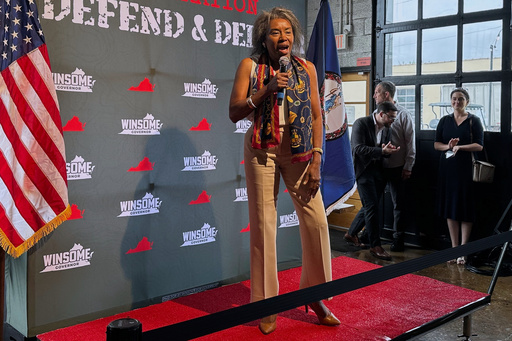 Republican Winsome Earle-Sears greets voters at her military-themed rally at Saucy’s Sit-Down Bar.B.Q in Hopewell, Va., on Aug. 1, 2025. (AP Photo/Olivia Diaz)