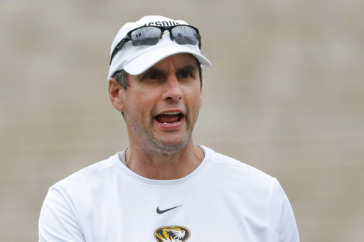 FILE - Missouri offensive coordinator Derek Dooley calls out instructions during an NCAA college football practice, Aug. 12, 2019, in Columbia, Mo. (AP Photo/Jeff Roberson, File)
